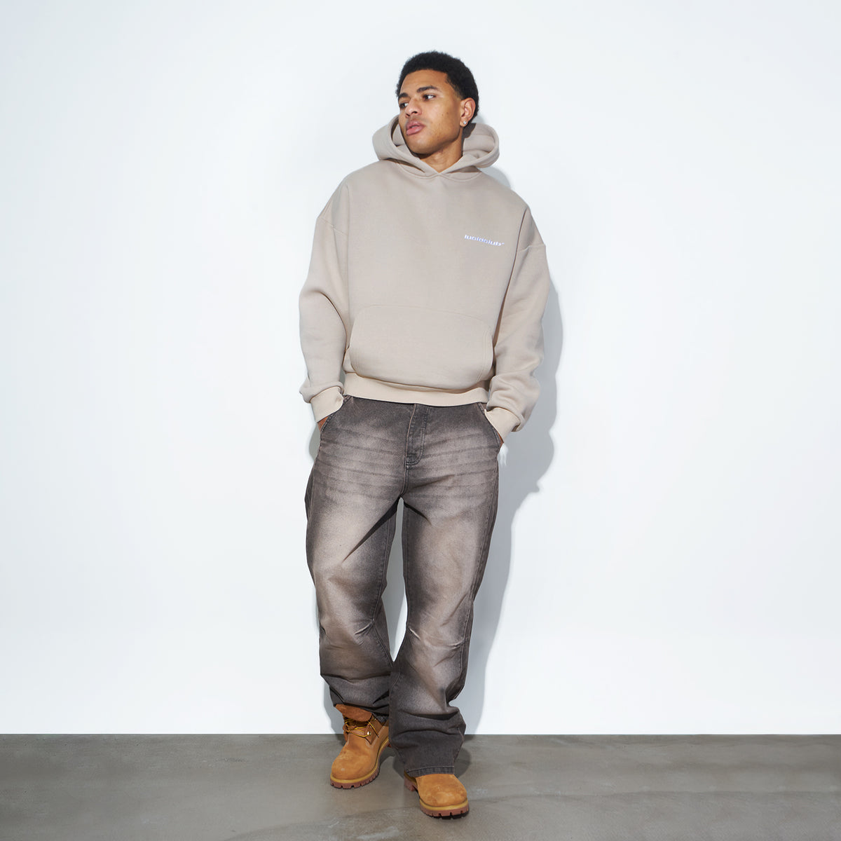 Star Denim Smoked Mocha on model, front view with beige hoodie