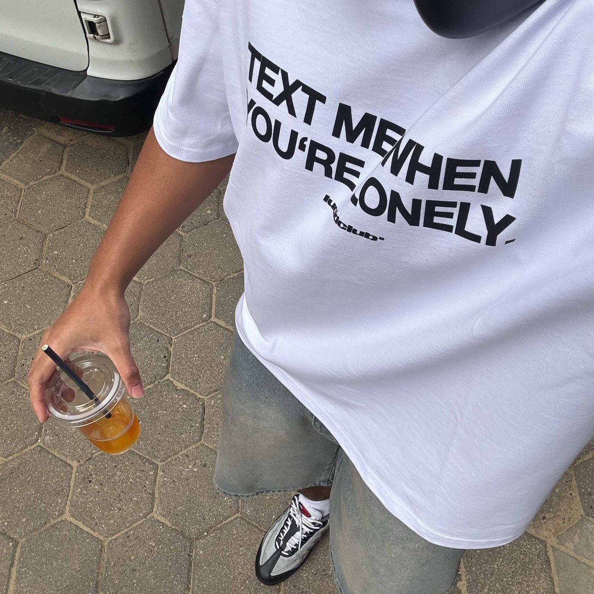 Text Me T-Shirt White on model, close up of the print