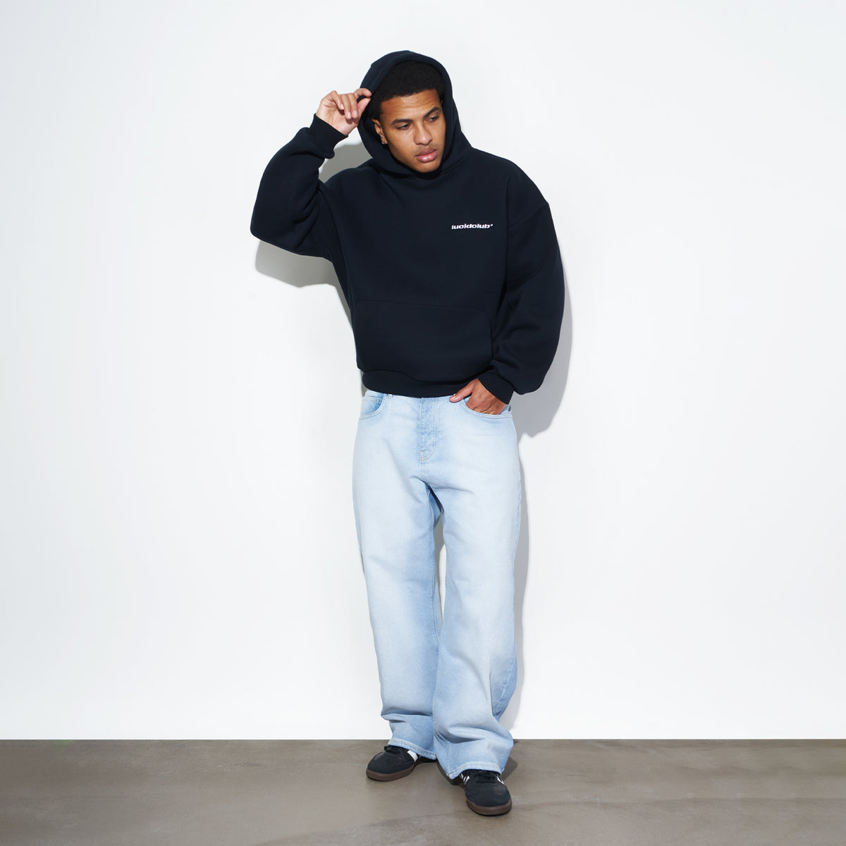 Star Denim Horizon Blue on model, front view with black hoodie