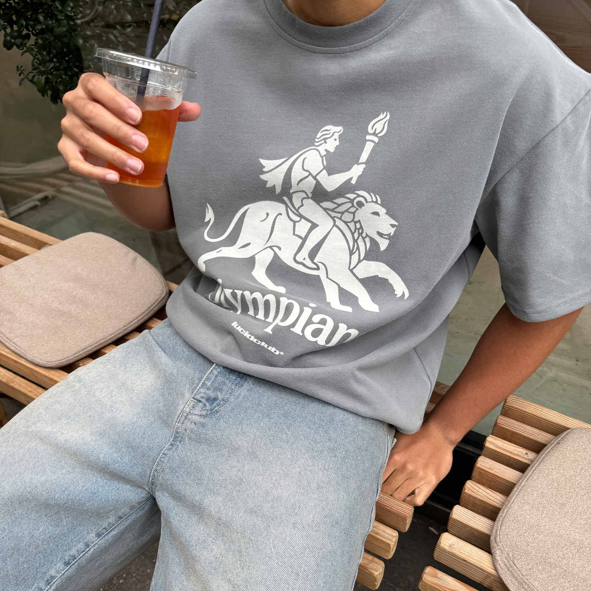 Olympian T-Shirt on model, close up of the print